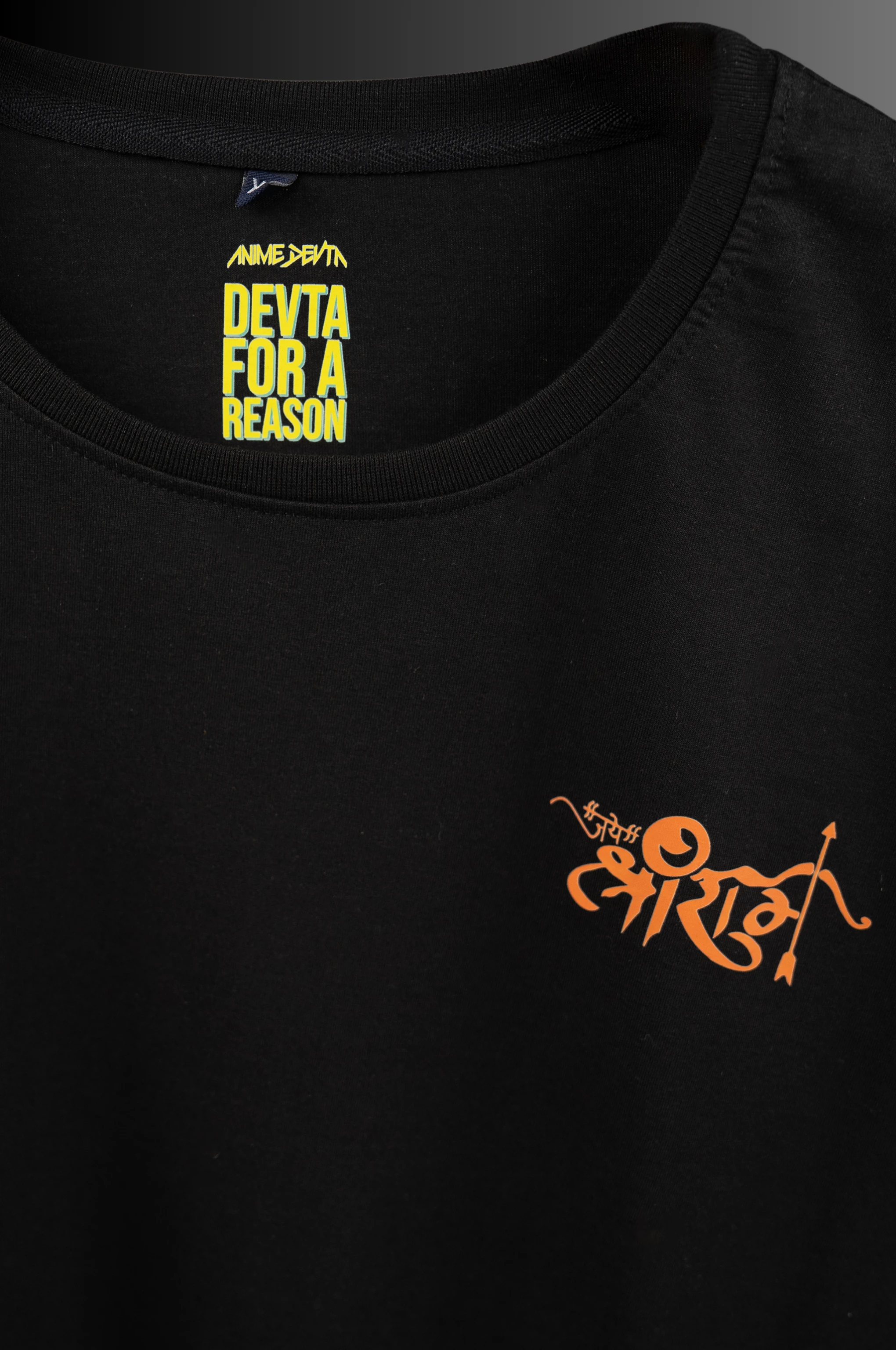 Original chest print and collar detail on the black T-shirt